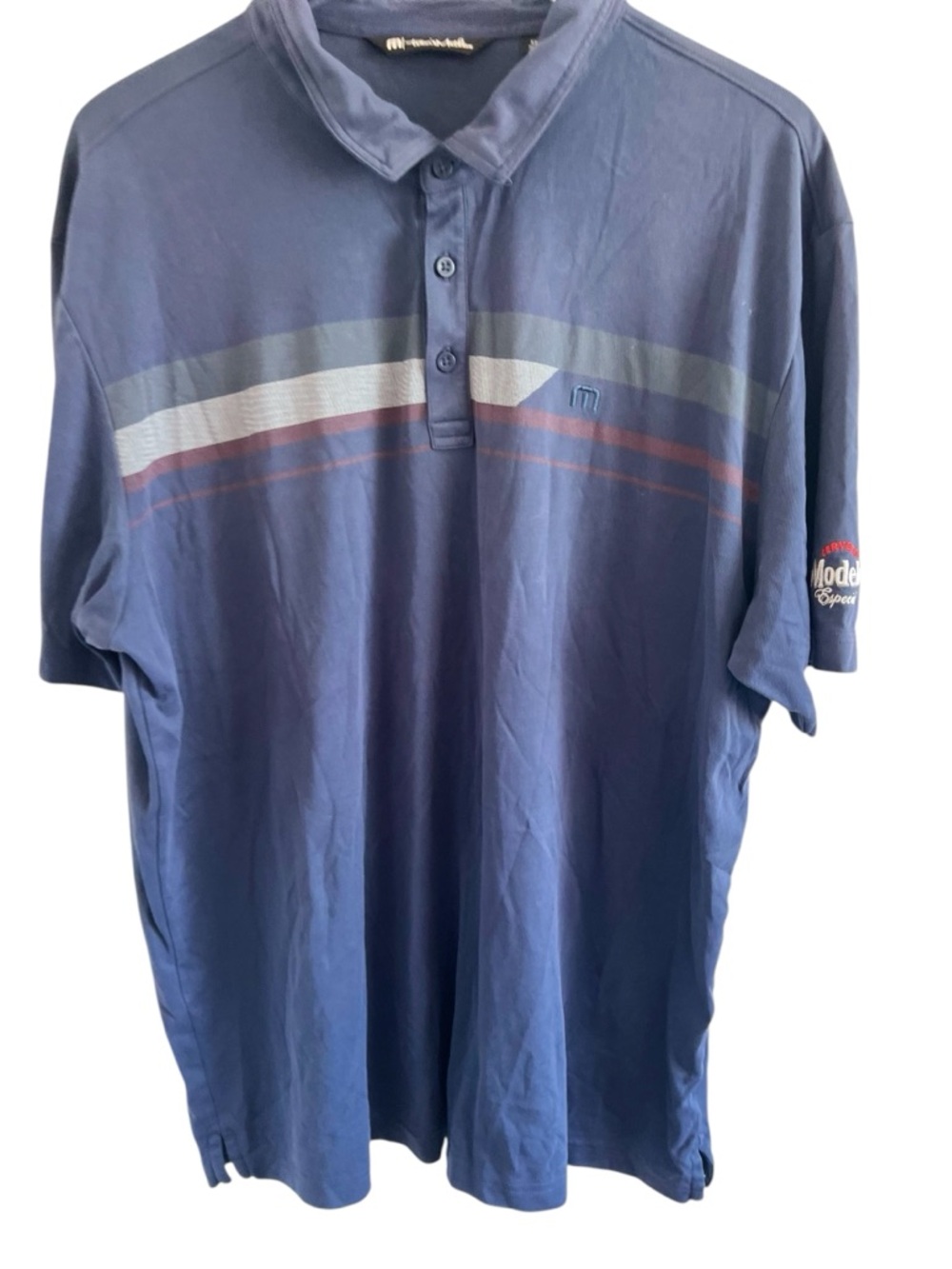 Travis Mathew’s Modelo Branded Blue Polo with Stripe Detail Shirt